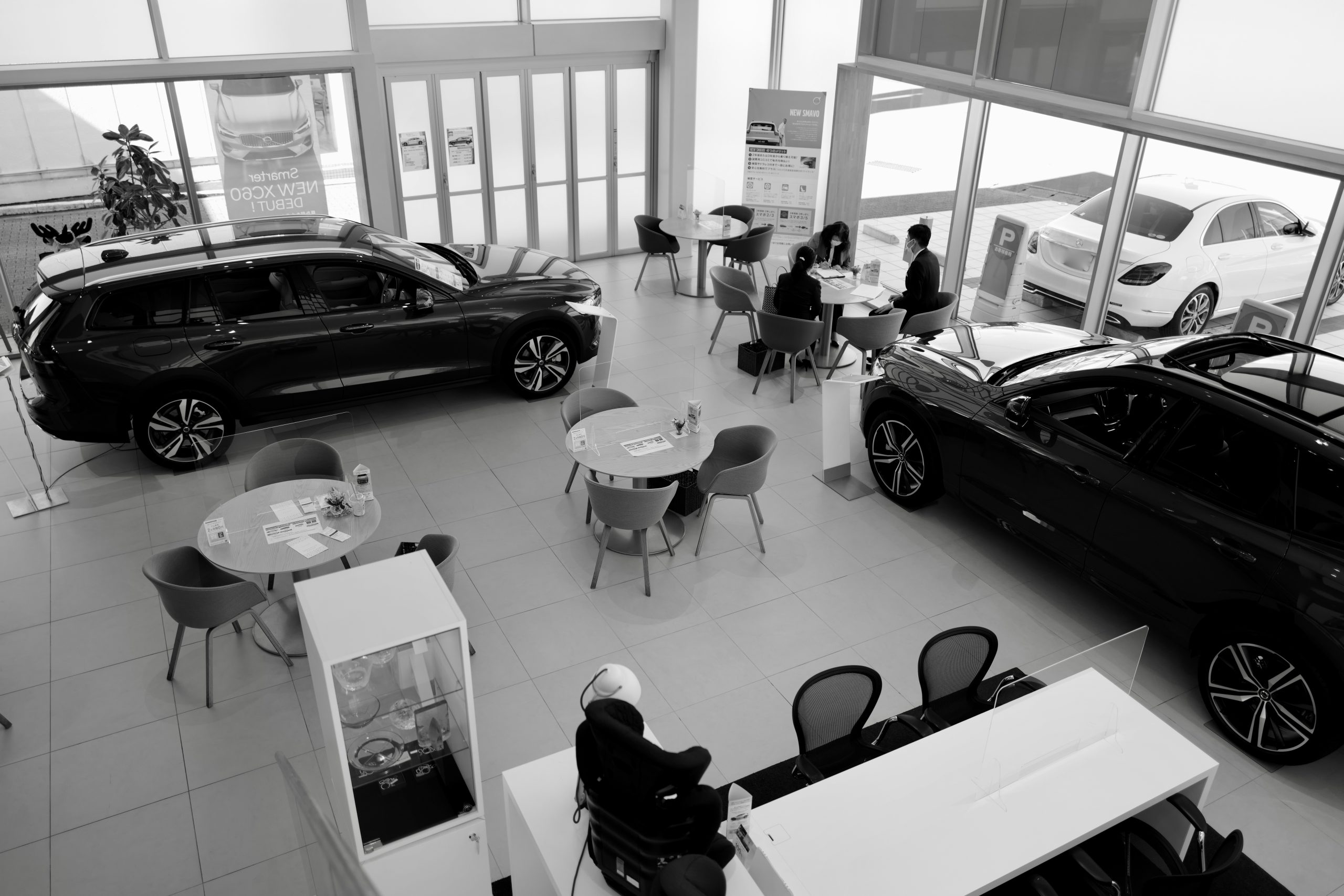 buyer signing paperwork for a new car loan